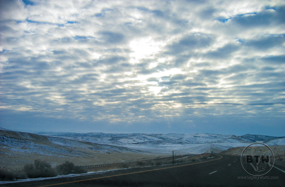 A winter highway in Idaho under cloudy skies