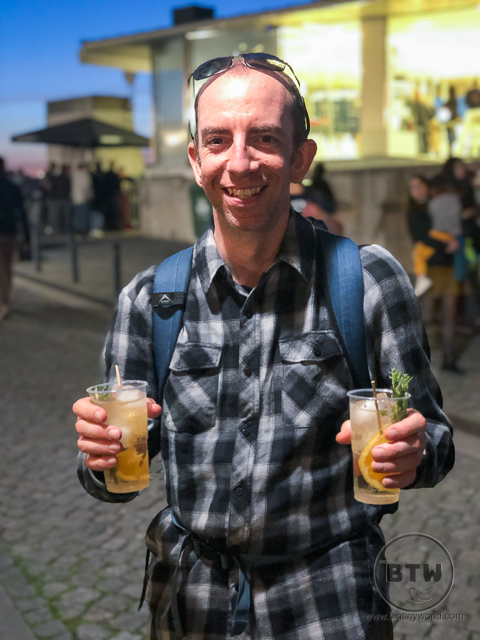Aaron Shade holding two port tonics in Gaia