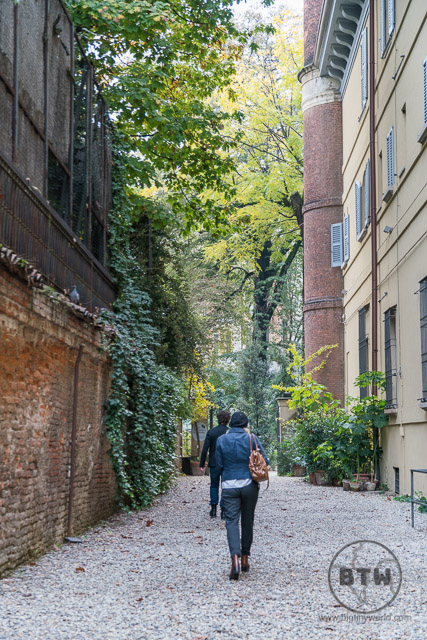 People walking toward a garden in Milan, Italy