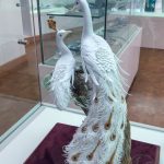 A porcelain figure of two white peacocks at the Museum of Ancient Glass in Zadar, Croatia