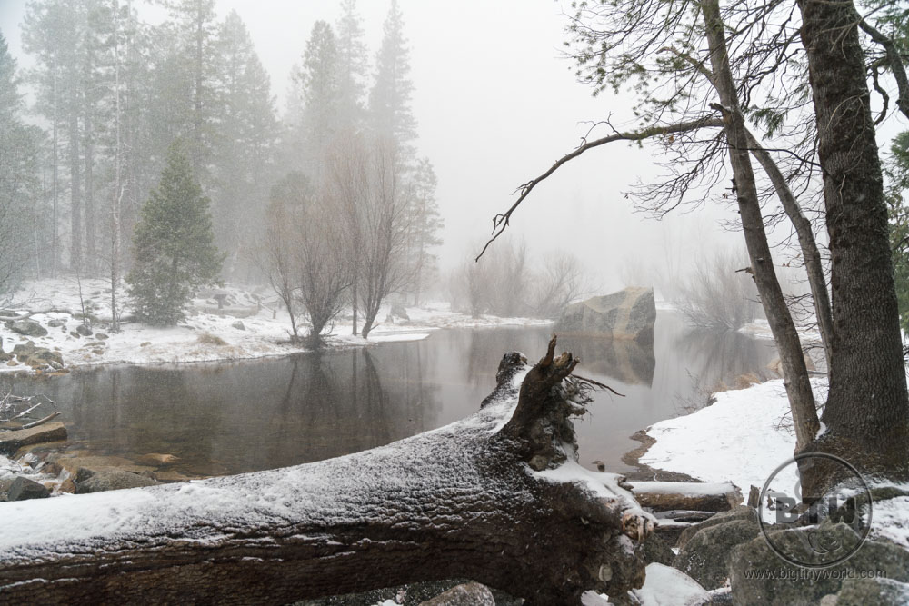 A lake shrouded in clouds as it snows in Yosemite National Park | BIG tiny World Travel