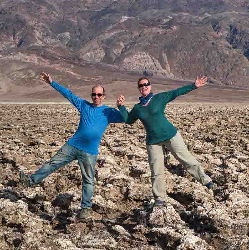 Aaron and Brianna posing on top of deposits in the Devil's Golf Course in Death Valley National Park | BIG tiny World Travel